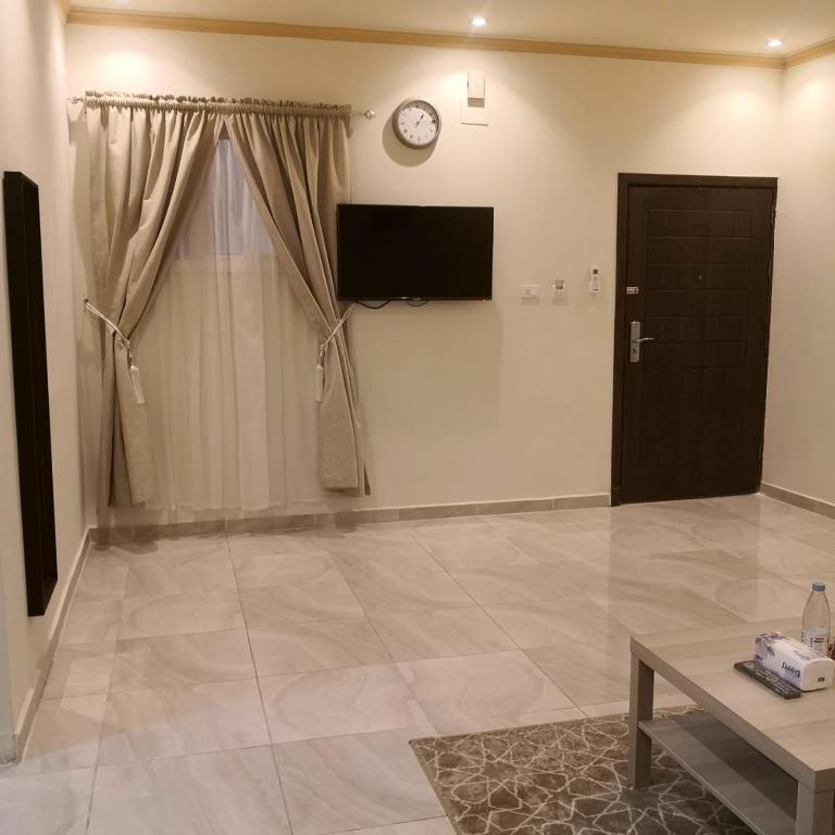TV a/nebo společenská místnost v ubytování روح الأصيلة للشقق المخدومة Roh Alaseilah Serviced Apartments