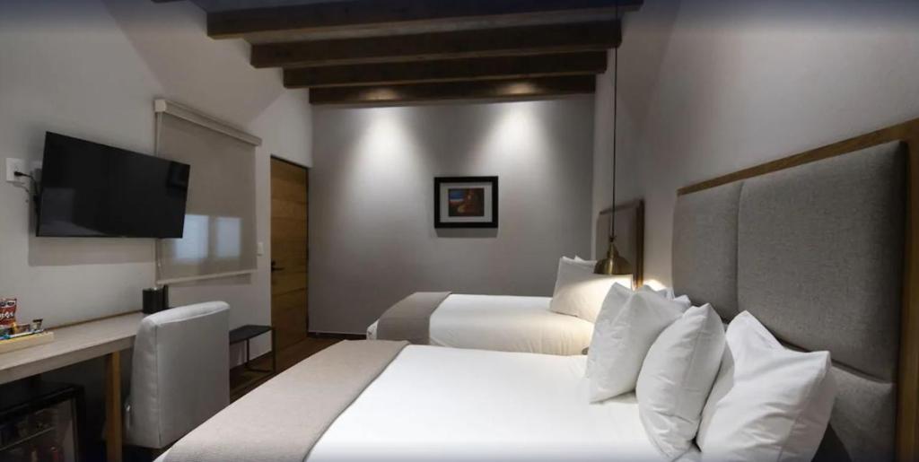 TV a/nebo společenská místnost v ubytování Hotel Madi