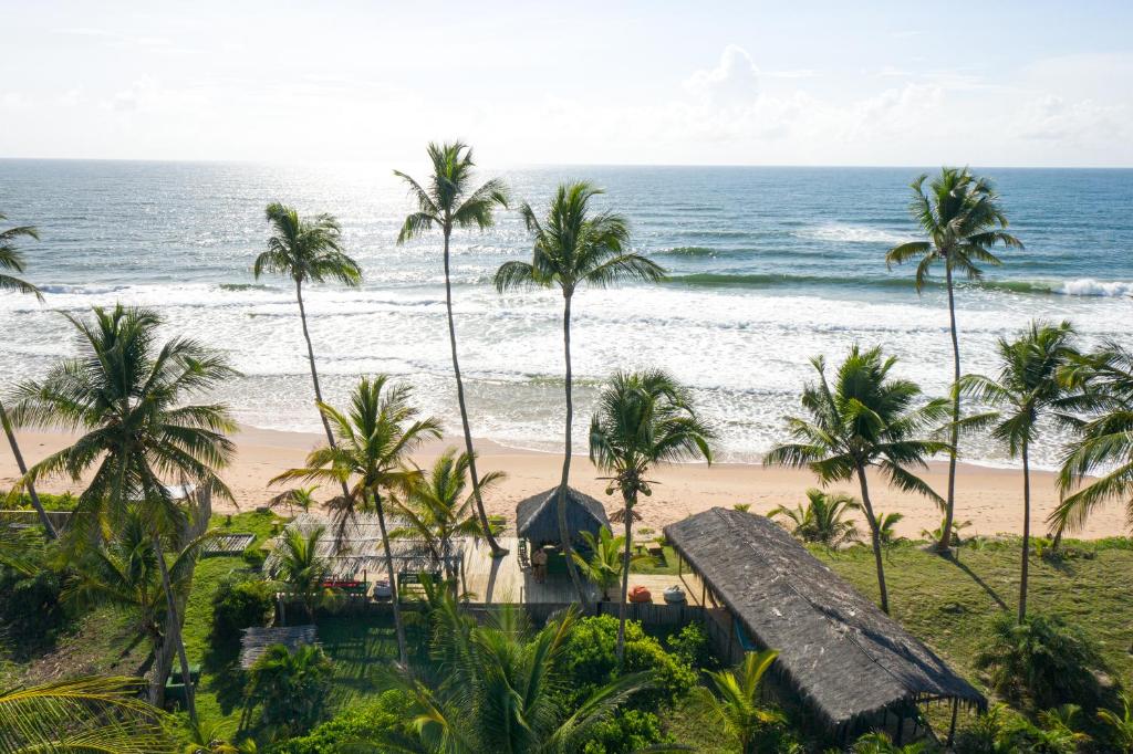 a view of the beach from the resort at Butterfly House Bahia in Marau