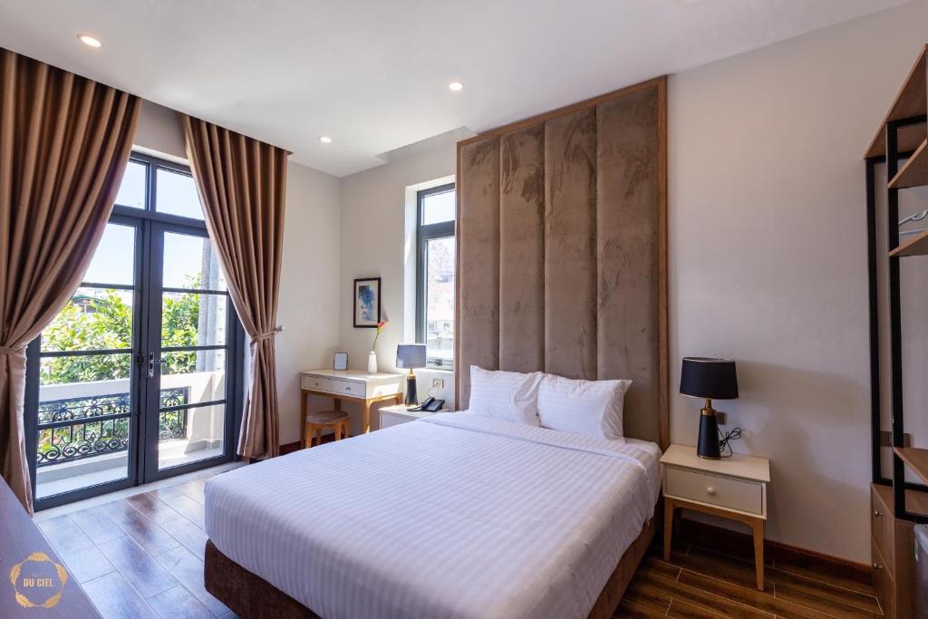 Ένα ή περισσότερα κρεβάτια σε δωμάτιο στο Hotel Du Ciel