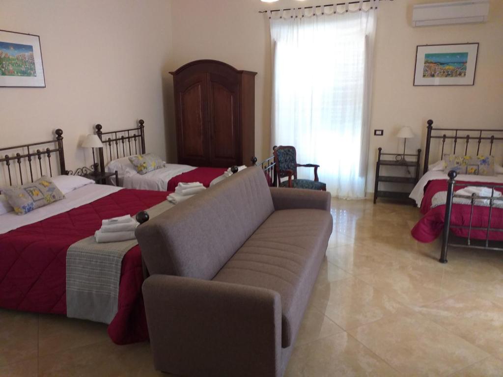 Posteľ alebo postele v izbe v ubytovaní B&B Batarà - "La Terrazza del Centro"