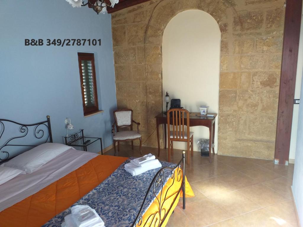 Posteľ alebo postele v izbe v ubytovaní B&B Batarà - "La Terrazza del Centro"