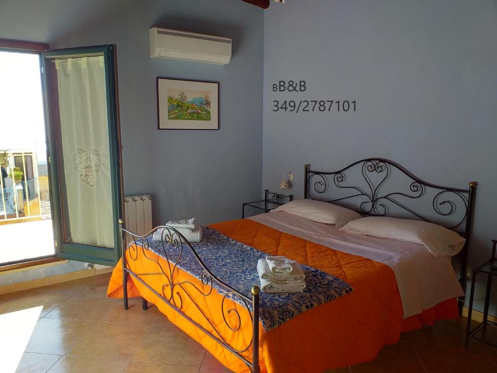 Posteľ alebo postele v izbe v ubytovaní B&B Batarà - "La Terrazza del Centro"