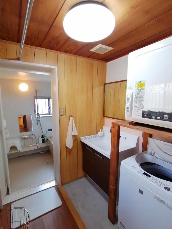 Postel nebo postele na pokoji v ubytování Yuzan apartment Sanjo