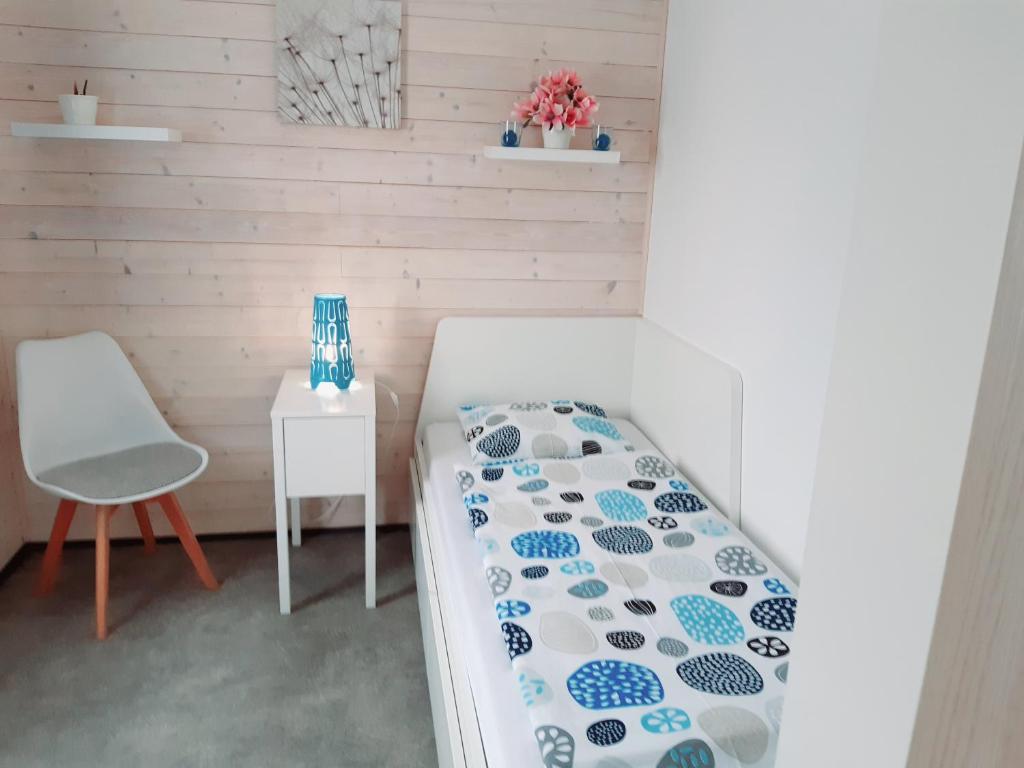 Łóżko lub łóżka w pokoju w obiekcie Apartment Moravský Kras