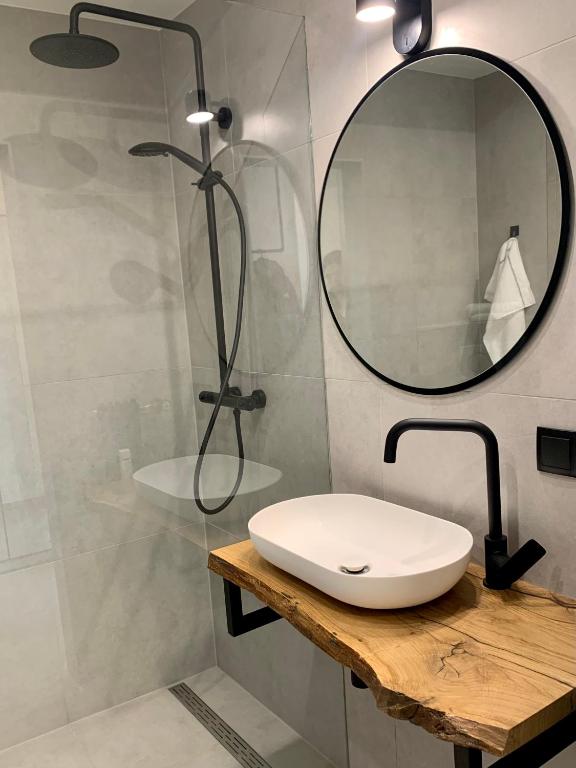 a bathroom with a sink and a mirror at Appartement 509 in Klagenfurt