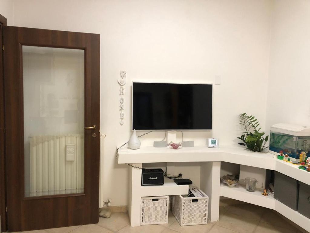 TV a/nebo společenská místnost v ubytování Appartamento Sole