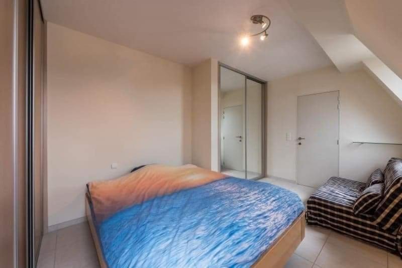 Postel nebo postele na pokoji v ubytování penthouse saint idesbald