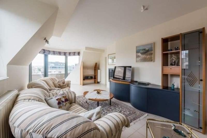 Postel nebo postele na pokoji v ubytování penthouse saint idesbald