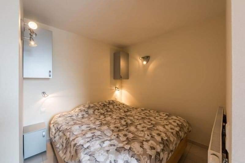 Postel nebo postele na pokoji v ubytování penthouse saint idesbald
