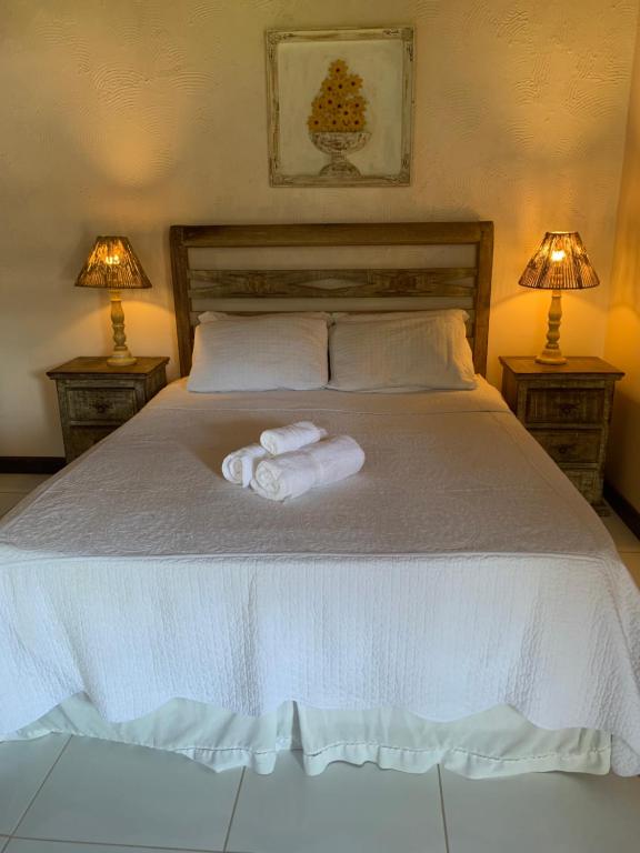 Cama ou camas em um quarto em Pousada Solar da Praia