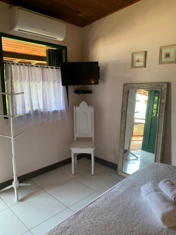 Cama ou camas em um quarto em Pousada Solar da Praia