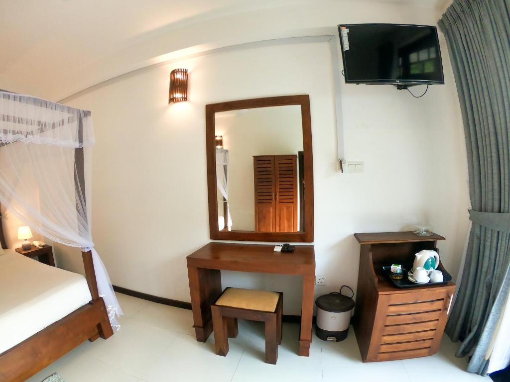 Postel nebo postele na pokoji v ubytování Kabalana Hotel & Villa