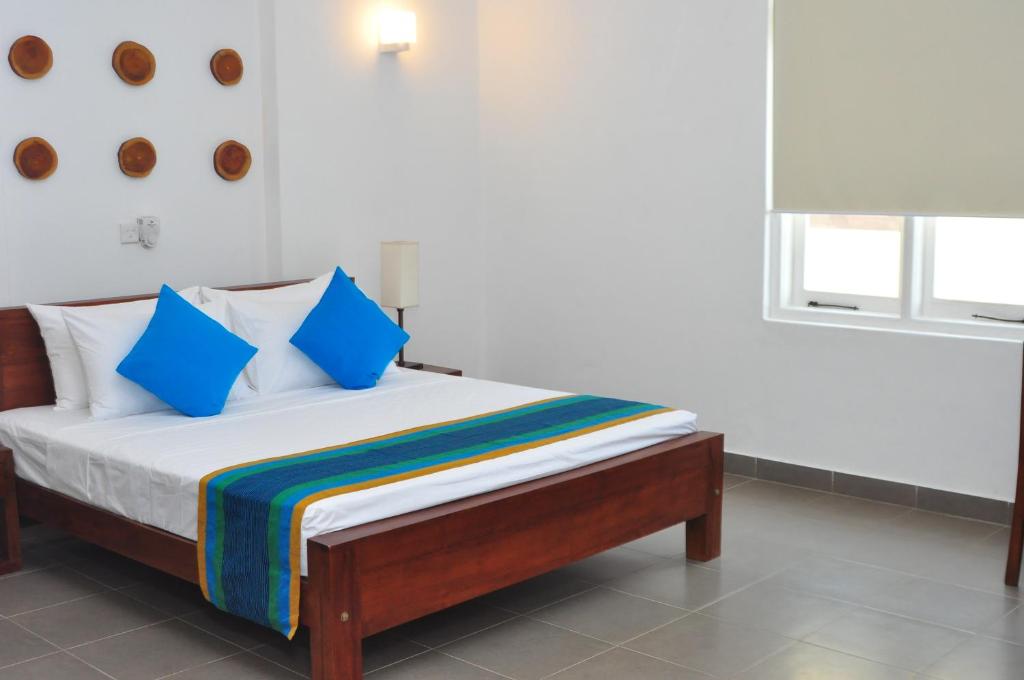 Postel nebo postele na pokoji v ubytování Comfort@15 Hotel Colombo