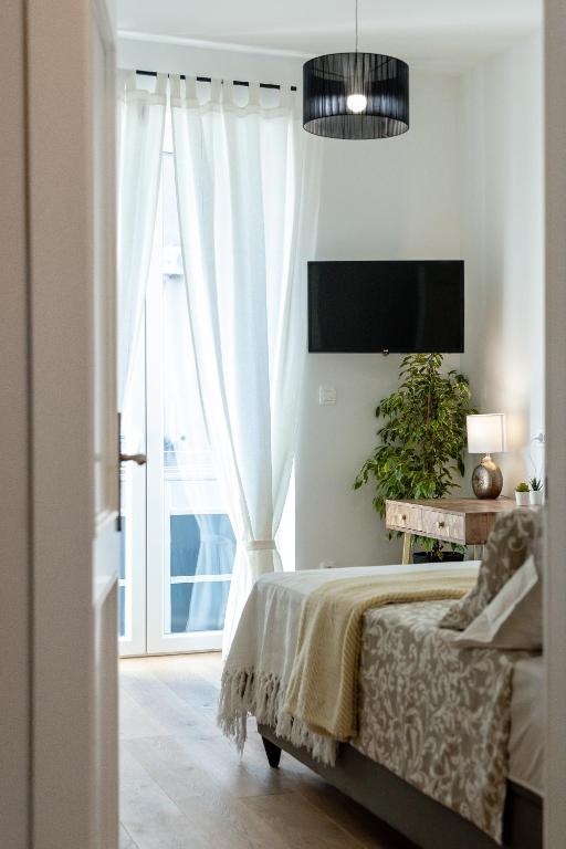 Posteľ alebo postele v izbe v ubytovaní Aurelia Residence