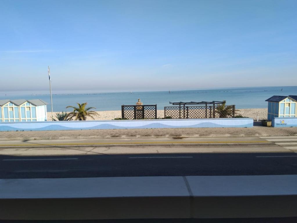 a view of a beach with houses and the ocean at TERRAZZA SUL MARE in Marotta