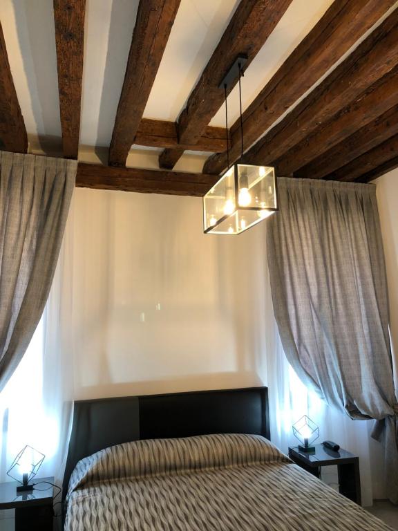 Voodi või voodid majutusasutuse Albergo Marin toas