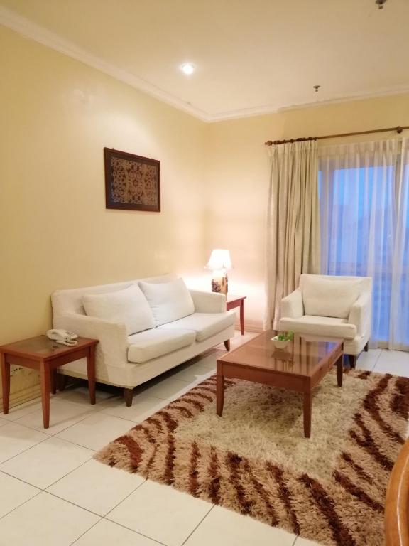 Χώρος καθιστικού στο StayInn Gateway Hotel Apartment