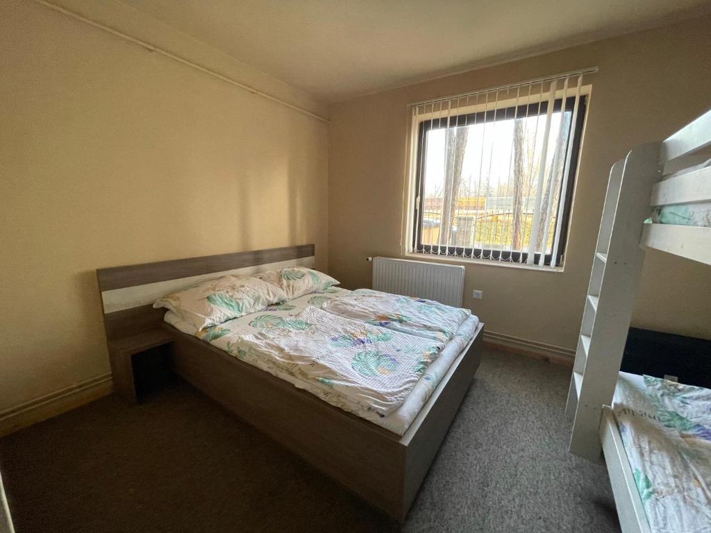 Postel nebo postele na pokoji v ubytování Grátisz Apartman Siófok