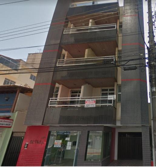 a tall building with a balcony on the side of it at Apartamento Praiana 303 in Guarapari