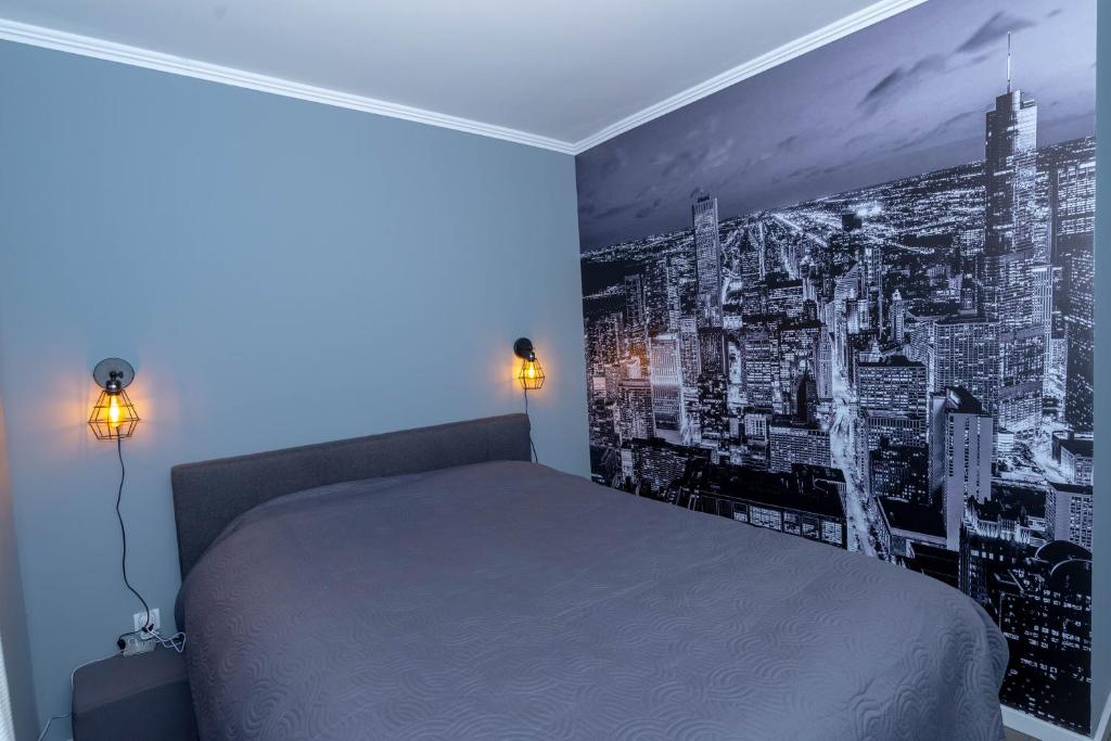 Postel nebo postele na pokoji v ubytování Athena Apartman