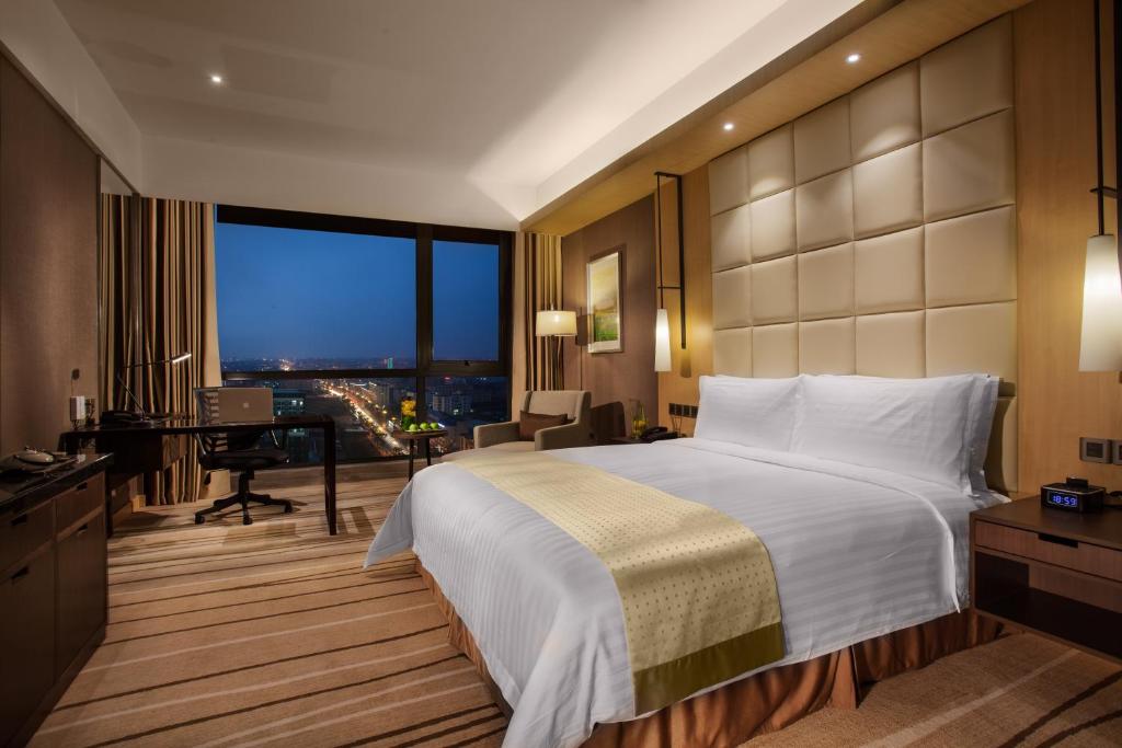 Postel nebo postele na pokoji v ubytování Holiday Inn Putian Xiuyu by IHG