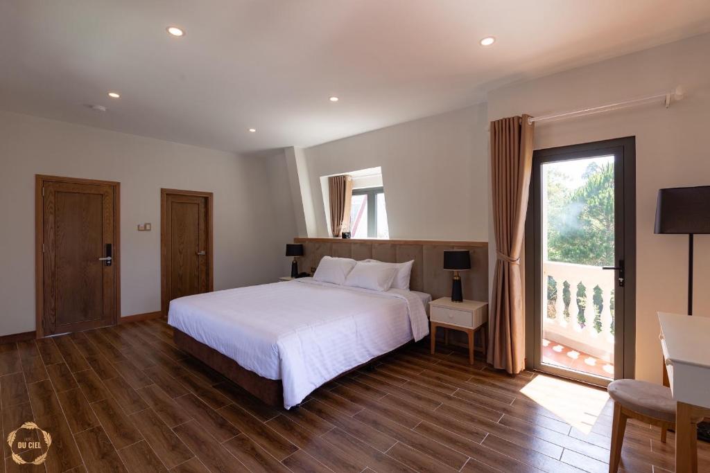 Postel nebo postele na pokoji v ubytování Hotel Du Ciel