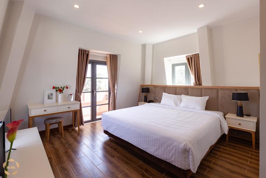 Postel nebo postele na pokoji v ubytování Hotel Du Ciel