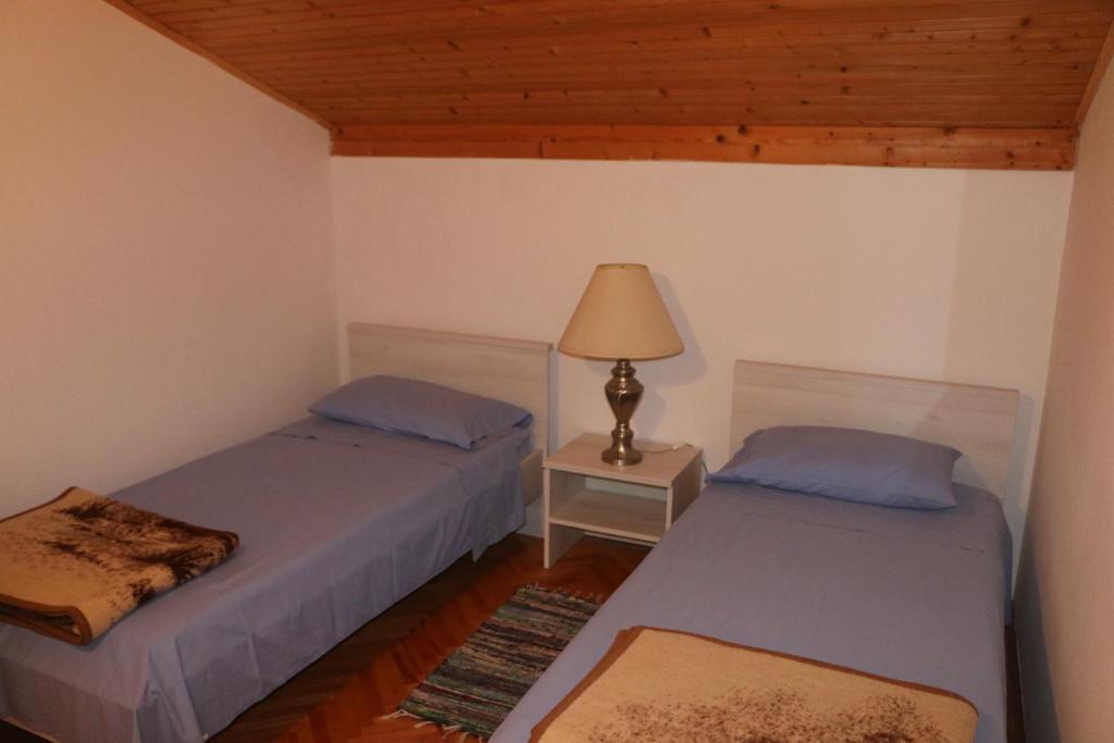 Postel nebo postele na pokoji v ubytování Apartment Grgas-Tucilo