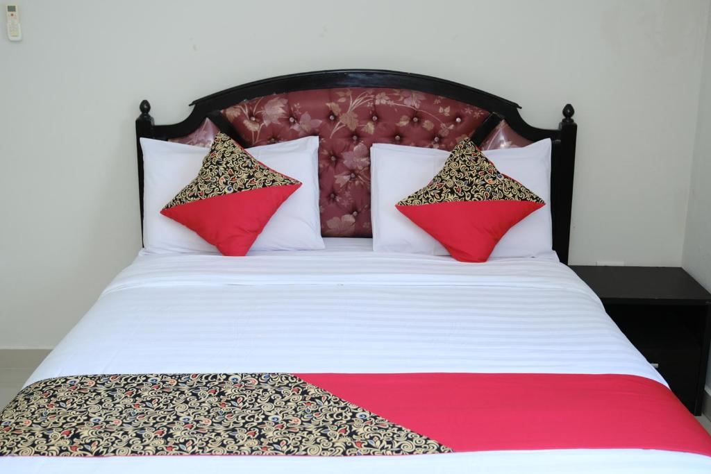 Postel nebo postele na pokoji v ubytování Joyful Hotel