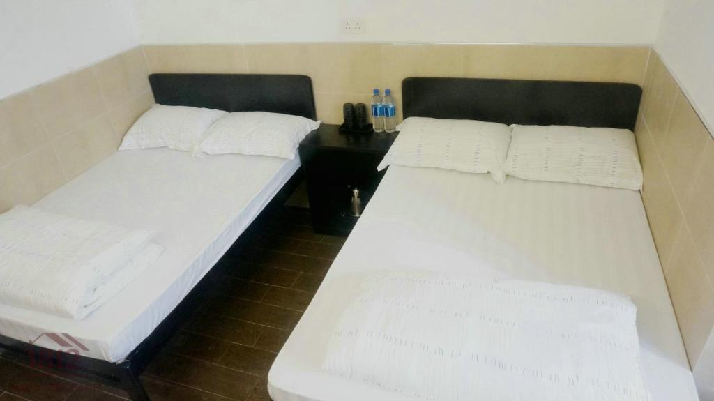Postel nebo postele na pokoji v ubytování Kowloon Mongkok 1812 Guest House