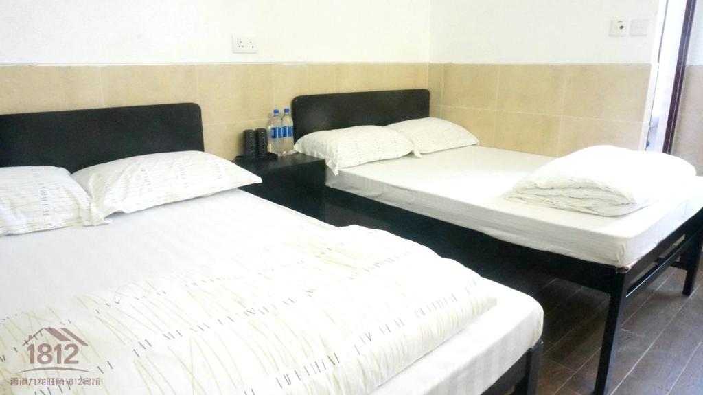 Postel nebo postele na pokoji v ubytování Kowloon Mongkok 1812 Guest House