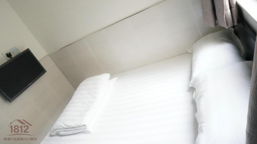Postel nebo postele na pokoji v ubytování Kowloon Mongkok 1812 Guest House
