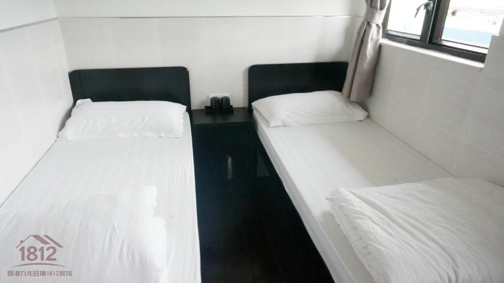 Postel nebo postele na pokoji v ubytování Kowloon Mongkok 1812 Guest House