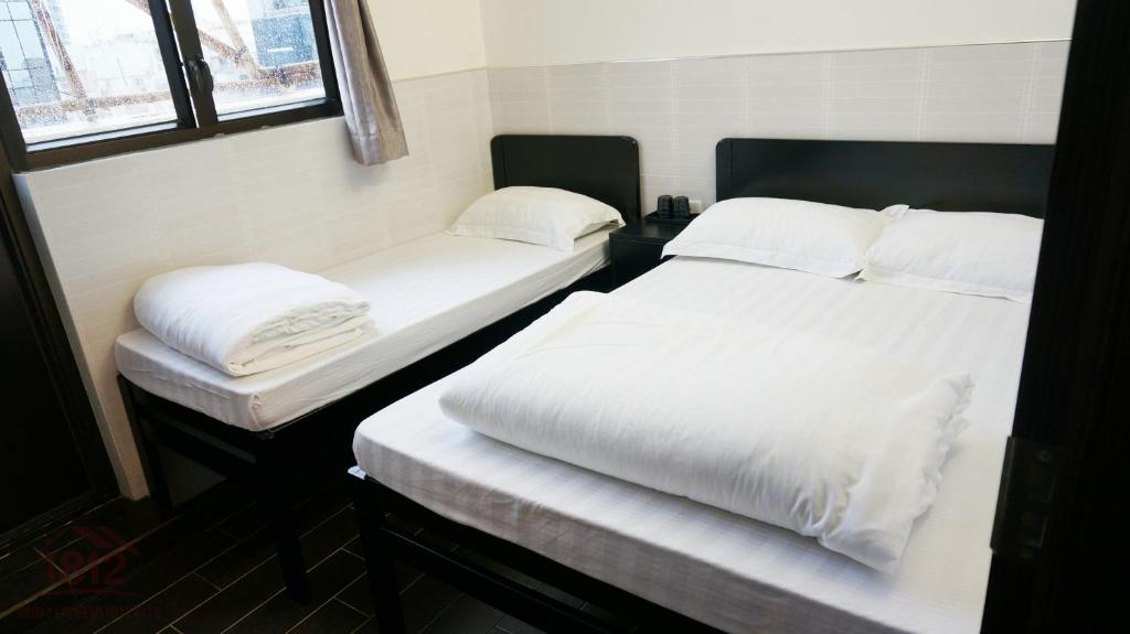 Postel nebo postele na pokoji v ubytování Kowloon Mongkok 1812 Guest House