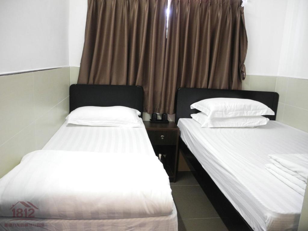 Postel nebo postele na pokoji v ubytování Kowloon Mongkok 1812 Guest House
