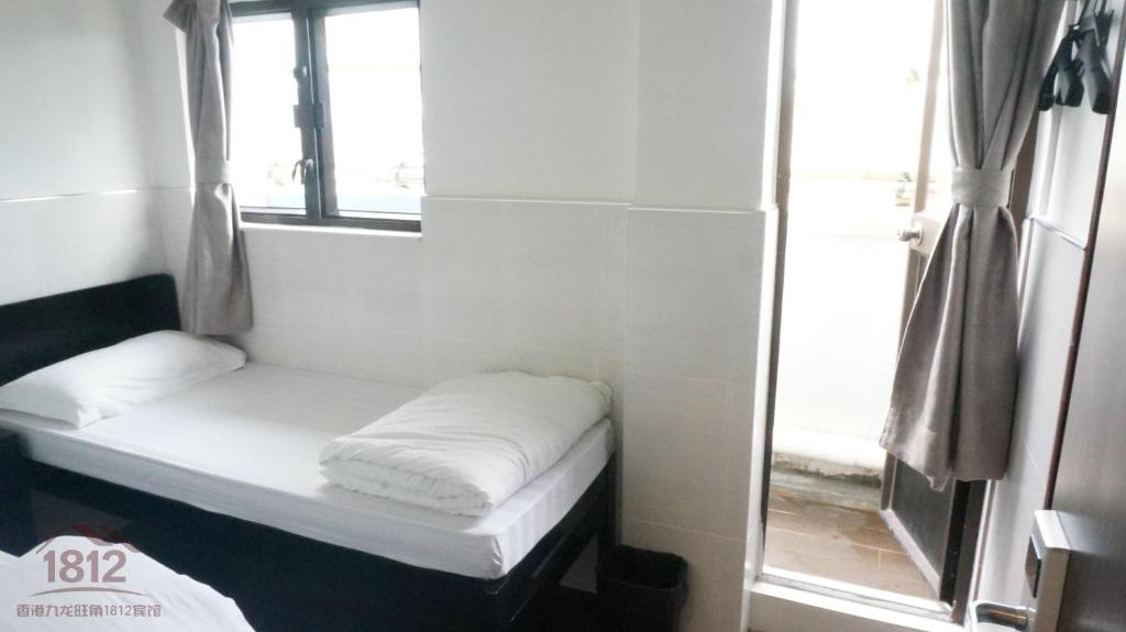 Postel nebo postele na pokoji v ubytování Kowloon Mongkok 1812 Guest House