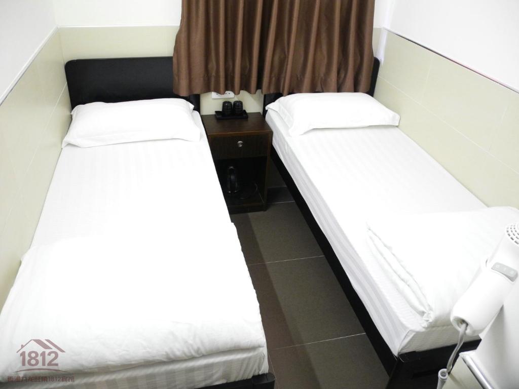 Postel nebo postele na pokoji v ubytování Kowloon Mongkok 1812 Guest House