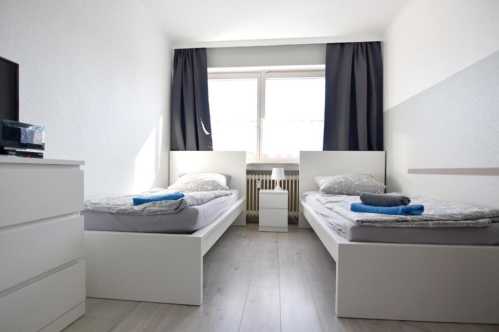 Llit o llits en una habitació de Easy Apartments Work and Stay Cologne