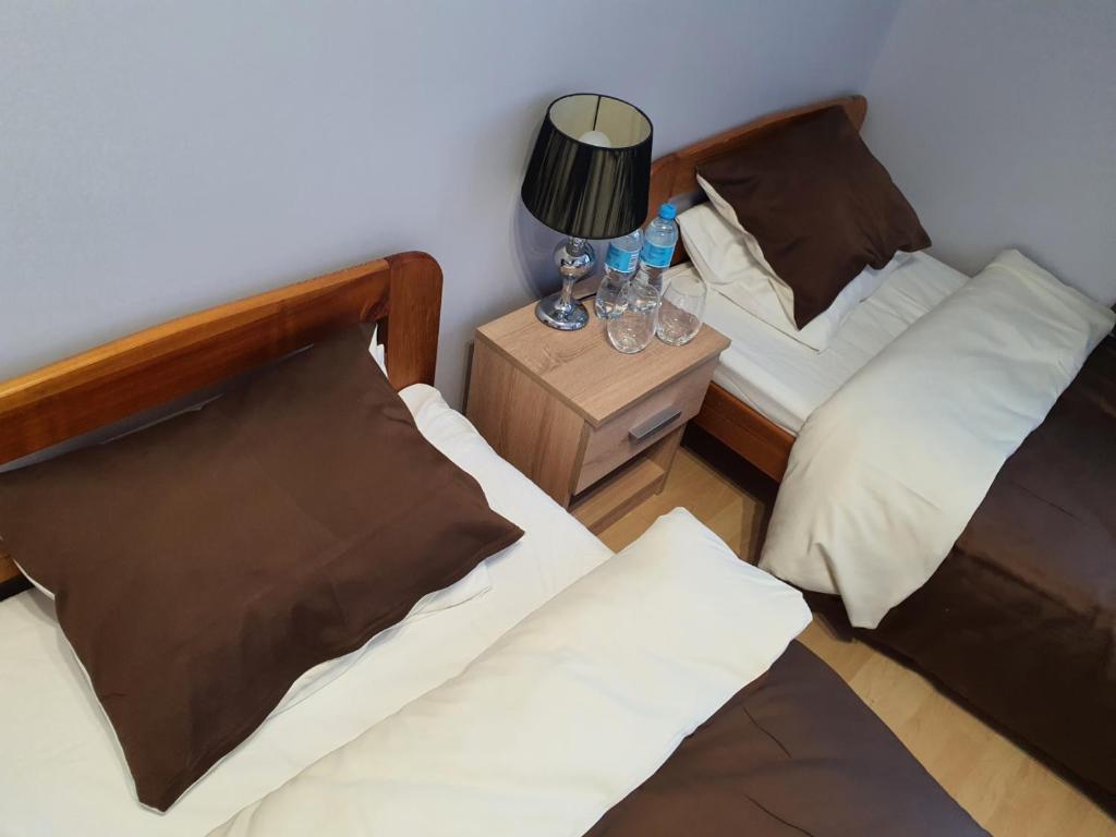 Posteľ alebo postele v izbe v ubytovaní Jasna Hotelik self check-in