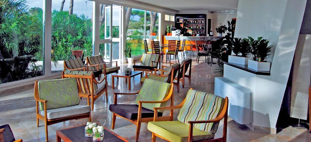 a restaurant with a bunch of chairs and tables at Torre Del Sole in Terracina