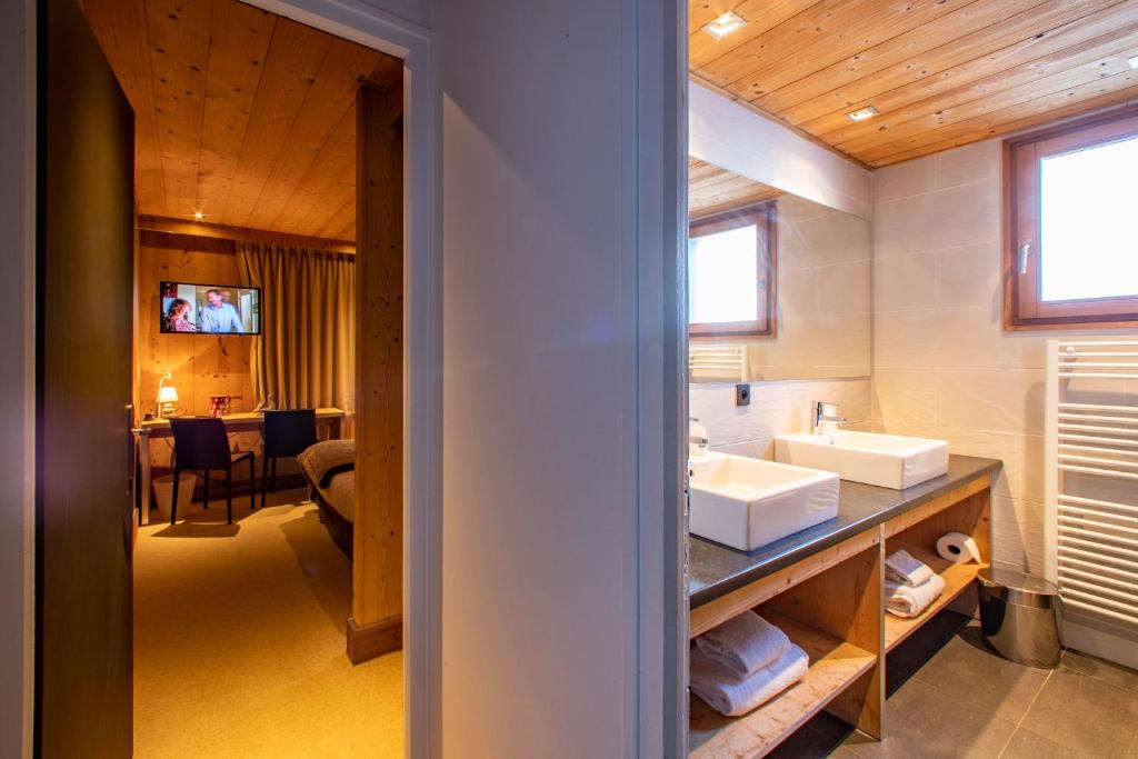 Postel nebo postele na pokoji v ubytování Chalet Les Rhodos