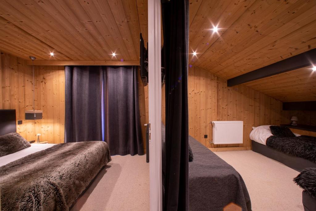 Postel nebo postele na pokoji v ubytování Chalet Les Rhodos