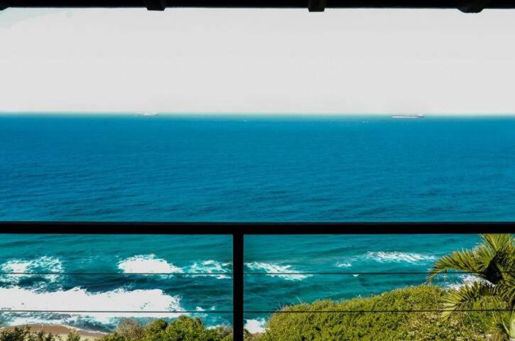 a view of the ocean from a balcony at Seaside Retreat- Main House in Durban