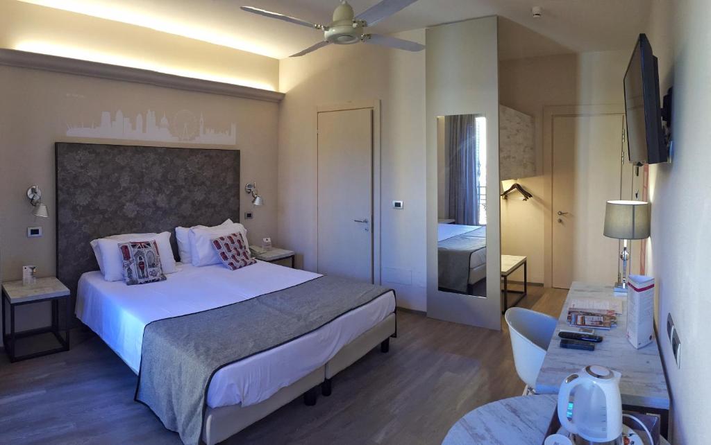 Postel nebo postele na pokoji v ubytování Hotel Touring
