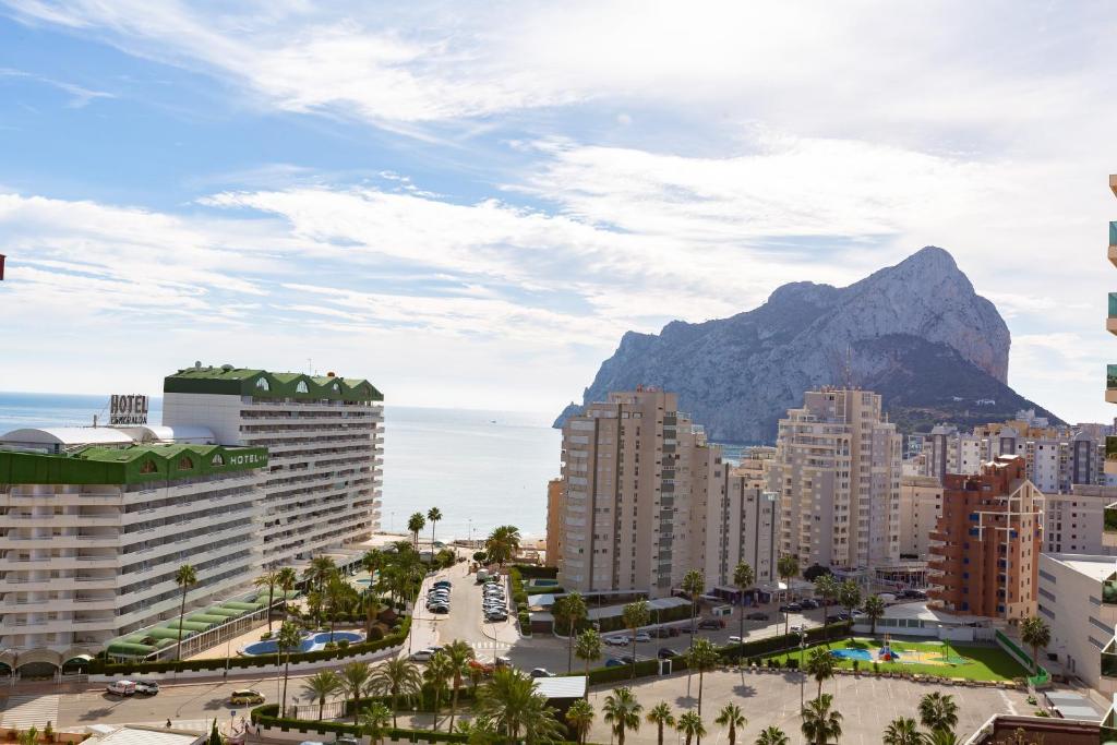 a view of a city with a mountain in the background at Ambar Beach Morpar Calp in Calpe