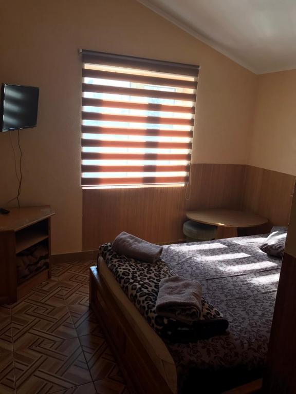 Postel nebo postele na pokoji v ubytování Мотель "Євро"