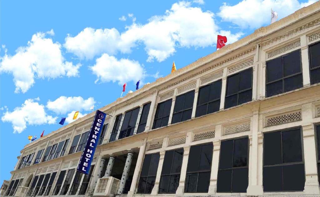 a building with a sign on the front of it at Central Hotel in Lucknow