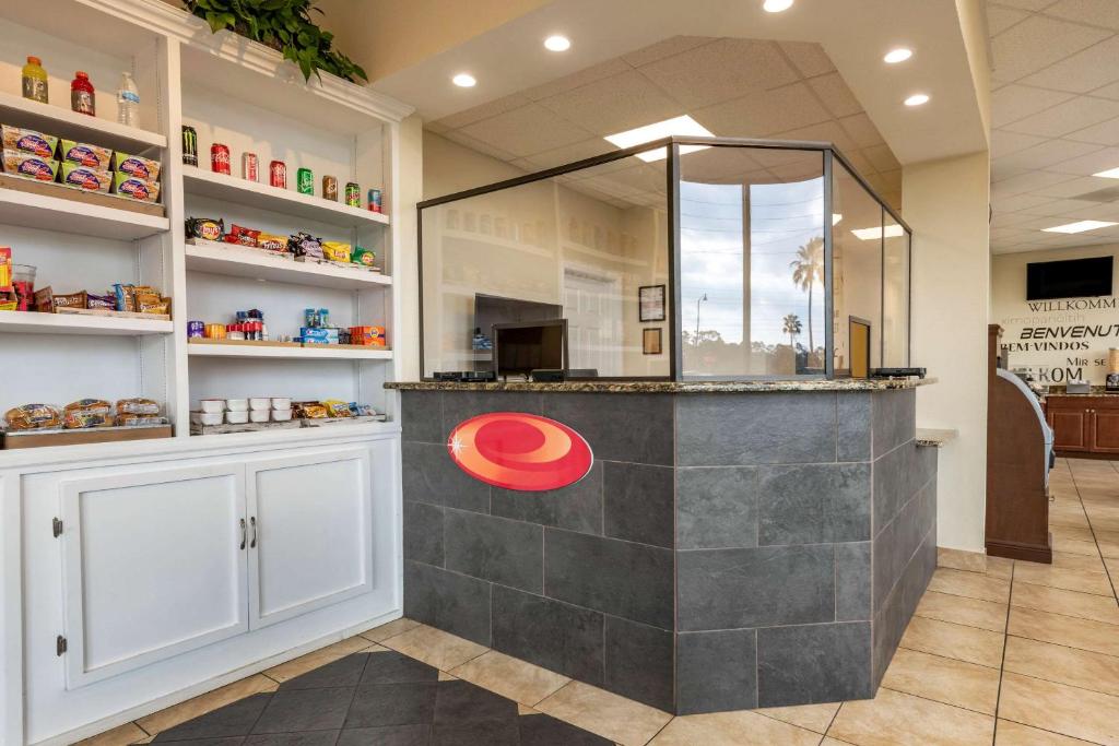 a counter in a store with a red circle on it at Econo Lodge Inn & Suites Maingate Central in Kissimmee