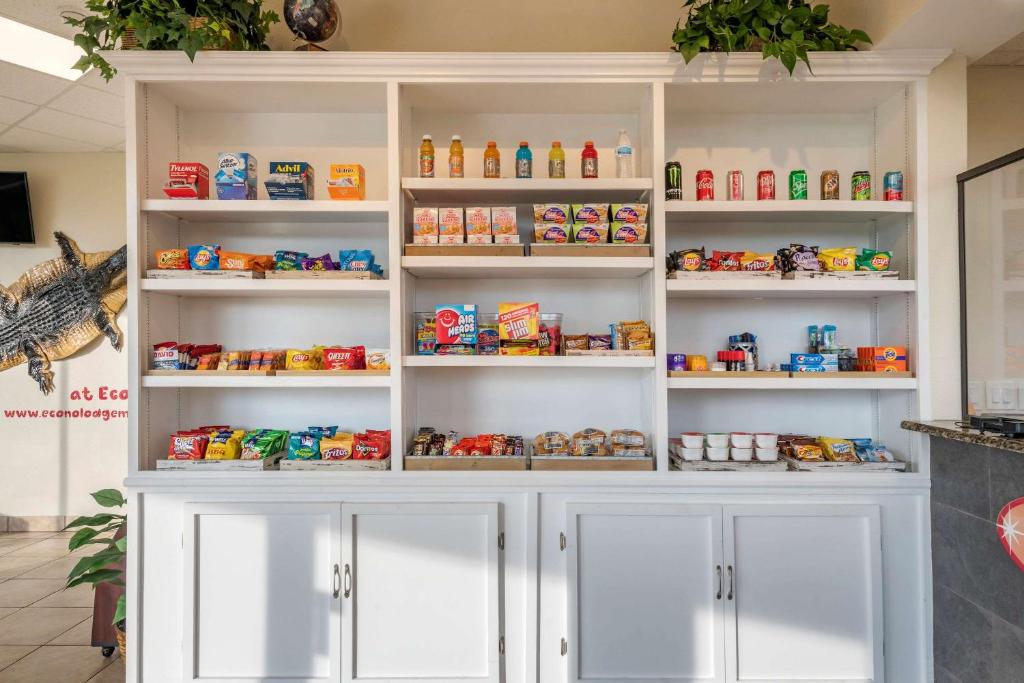 a white cabinet filled with lots of toys at Econo Lodge Inn & Suites Maingate Central in Kissimmee